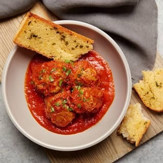 BAKED MEATBALLS (4) & GARLIC BREAD