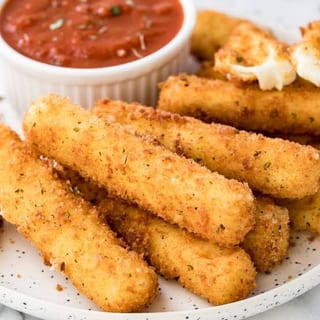 MOZZARELLA STICKS, Crispy on the outside, warm & melty on the inside!